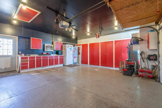 a view of an empty room with gym equipment