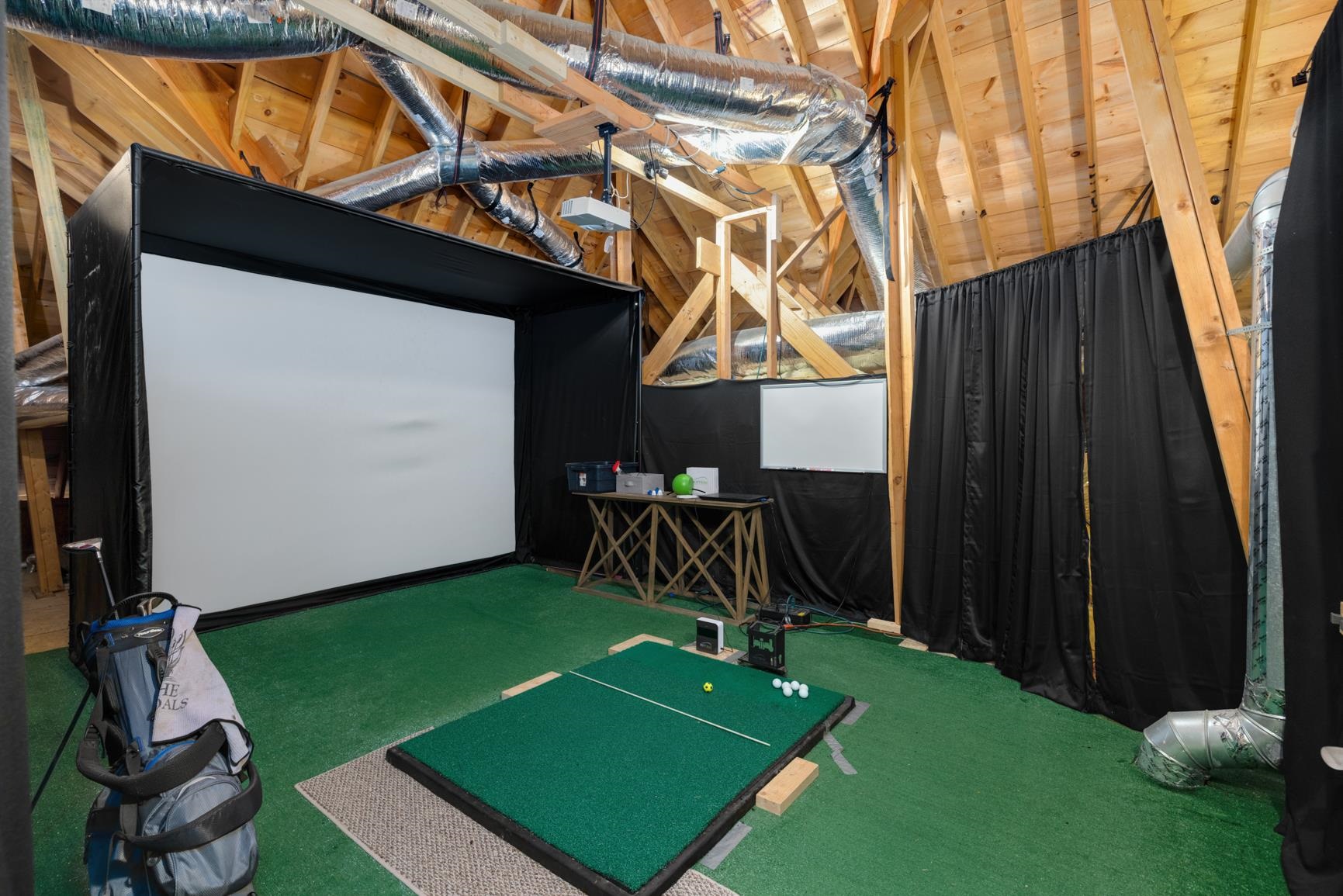 104 Eagle Trace Road Covington, TN 38019 - Photo 15 of 40 Playroom featuring golf simulator, vaulted ceiling, and carpet
