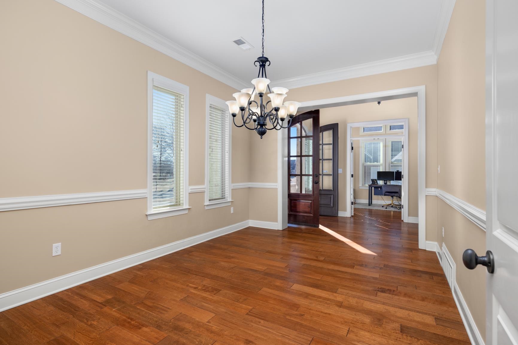 104 Eagle Trace Road Covington, TN 38019 - Photo 10 of 40 a view of an empty room with window and wooden floor