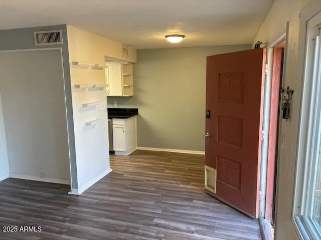 a kitchen with granite countertop a stove and a refrigerator