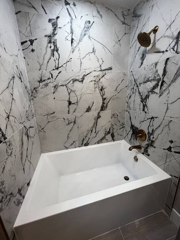 56 Pelham Street Methuen, MA 01844 - Photo 13 of 27 a bathroom with a bathtub