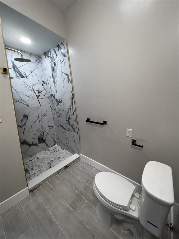 56 Pelham Street Methuen, MA 01844 - Photo 15 of 27 a bathroom with a toilet and shower