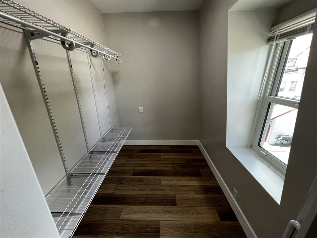 56 Pelham Street Methuen, MA 01844 - Photo 18 of 27 a view of staircase with white walls and a window