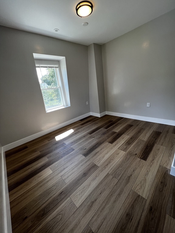 56 Pelham Street Methuen, MA 01844 - Photo 19 of 27 a view of empty room with wooden floor and fan