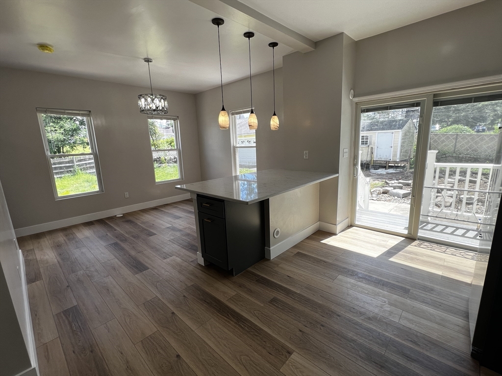 56 Pelham Street Methuen, MA 01844 - Photo 4 of 27 an empty room with wooden floor and windows