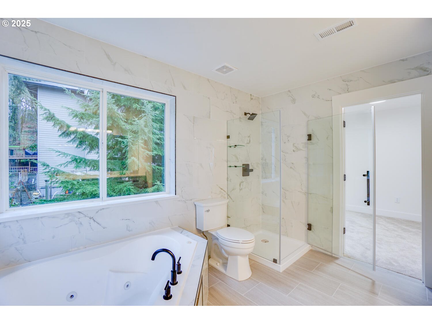 3704 Northwest Orchard Court Camas, WA 98607 - Photo 23 of 33 a bathroom with a bathtub shower sink mirror and toilet