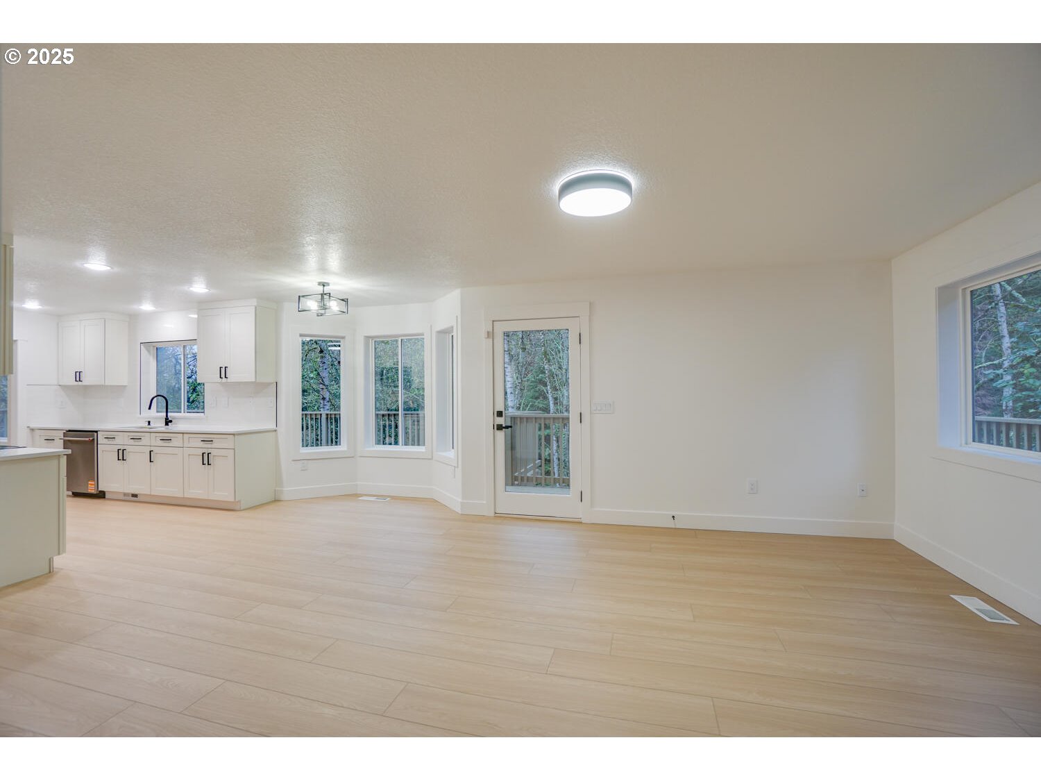 3704 Northwest Orchard Court Camas, WA 98607 - Photo 8 of 33 a view of an empty room with kitchen and window
