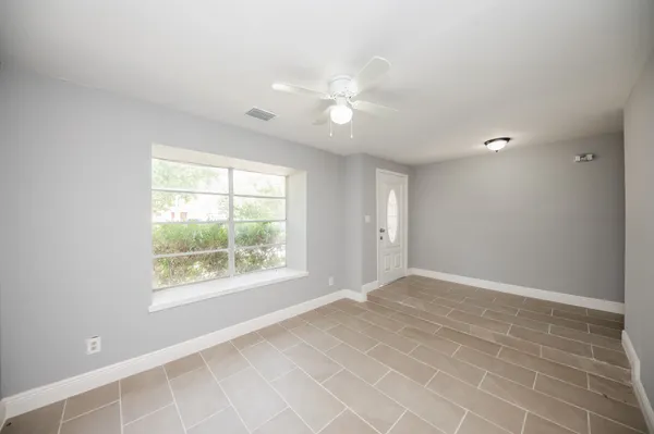 a view of an empty room with a window