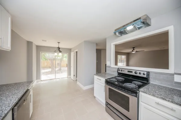a kitchen with a stove and a sink