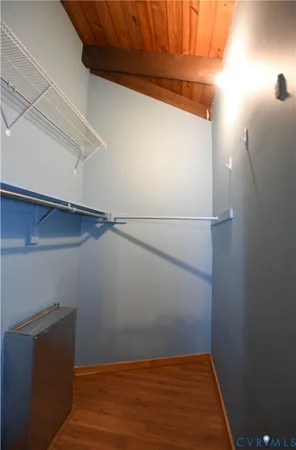 a view of a room with wooden floor