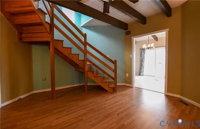 a view of an entryway with wooden floor