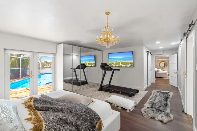 a spacious bathroom with a sink and a mirror