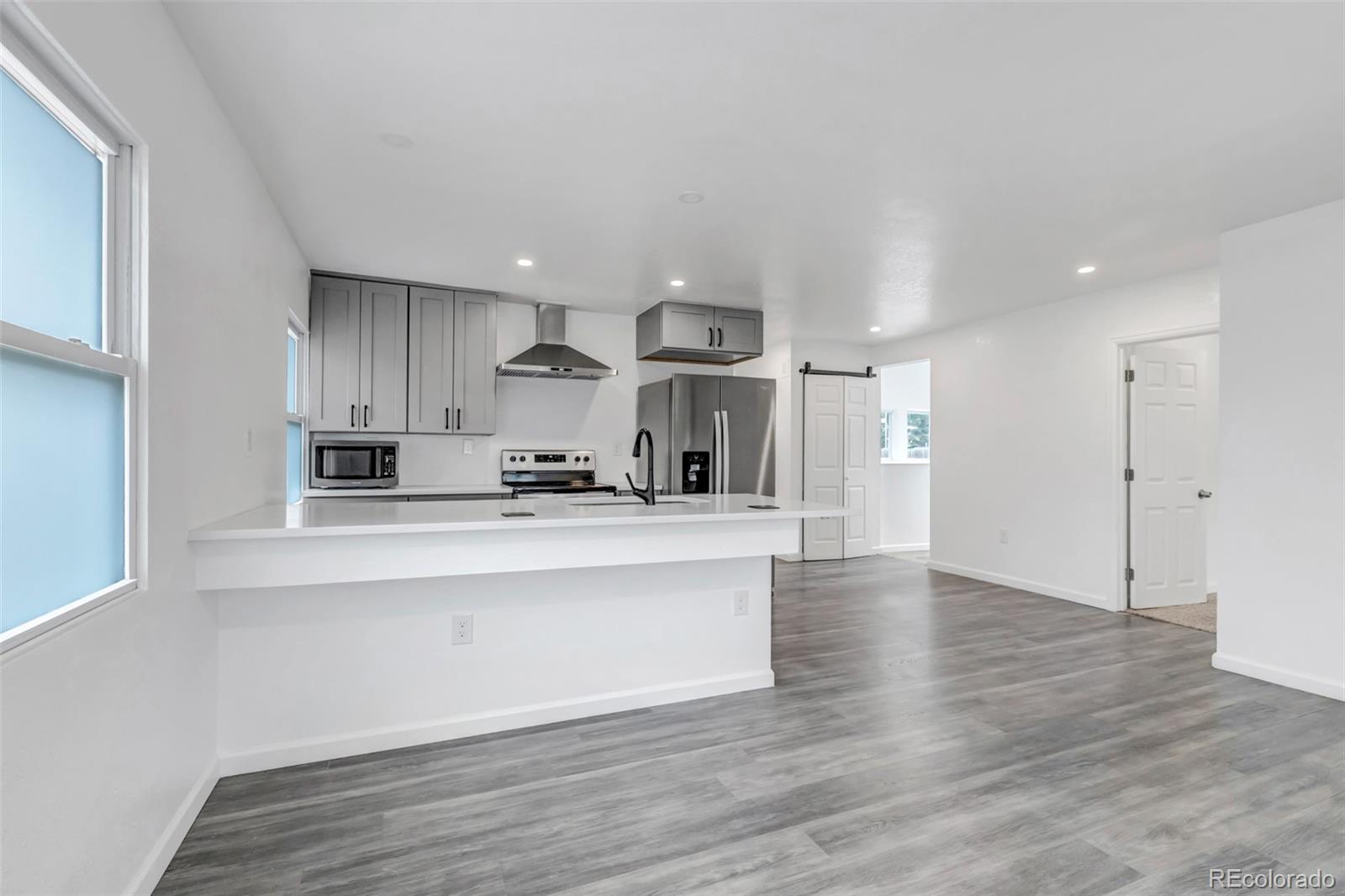 10 South Irving Street Denver, CO 80219 - Photo 13 of 35 a view of kitchen with wooden floor