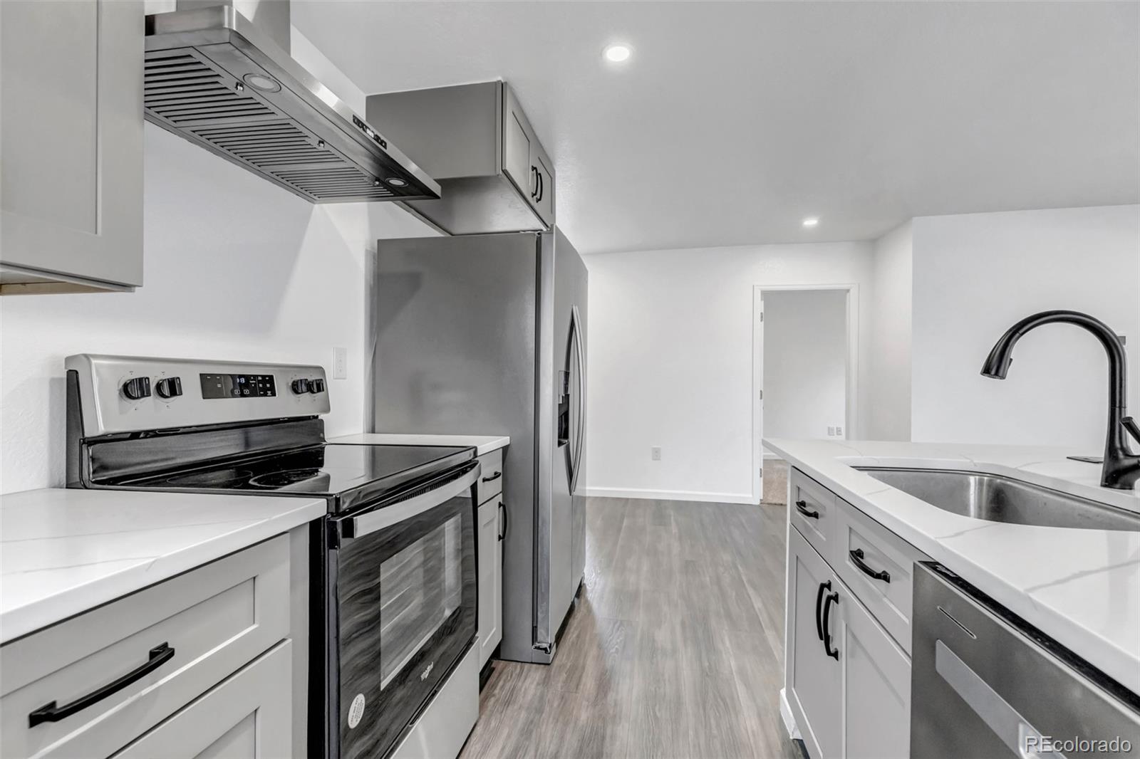 10 South Irving Street Denver, CO 80219 - Photo 18 of 35 a kitchen that has a sink and a stove