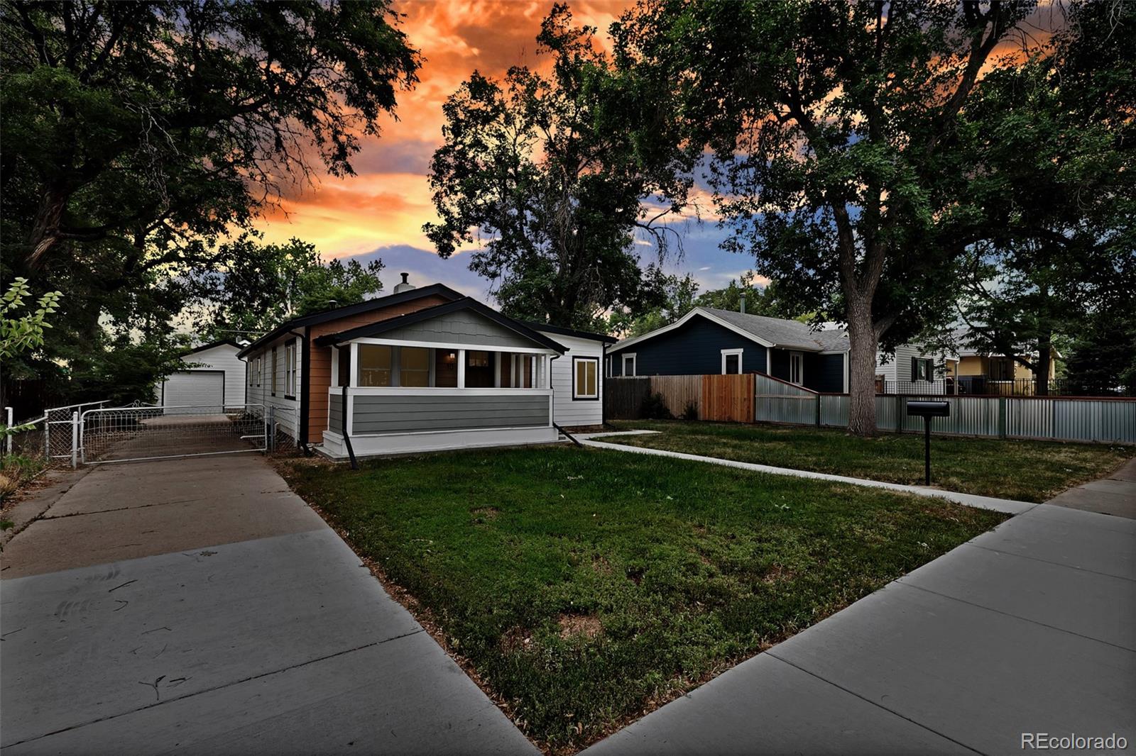 10 South Irving Street Denver, CO 80219 - Photo 2 of 35 a front view of a house with a yard and trees