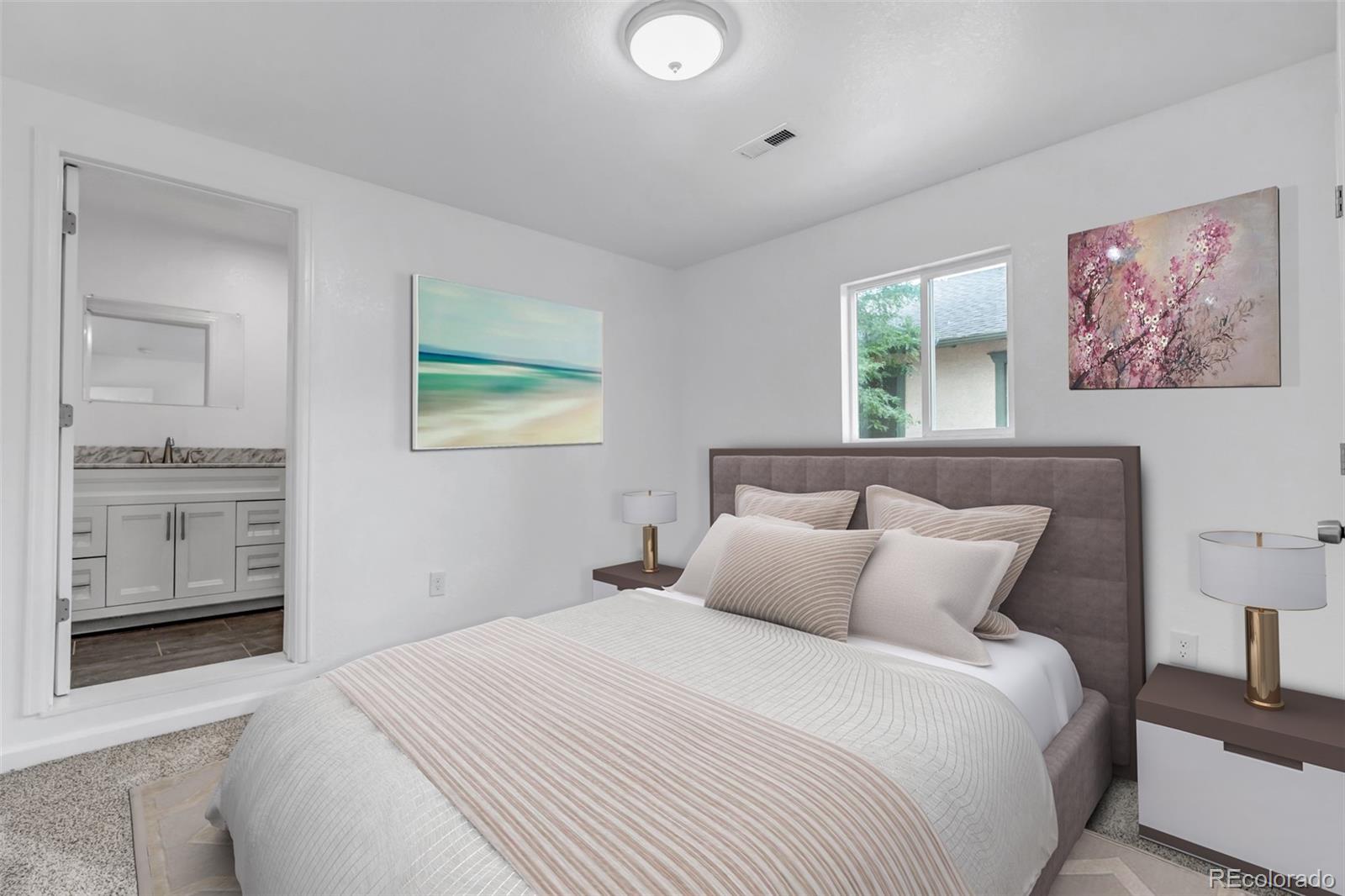 10 South Irving Street Denver, CO 80219 - Photo 21 of 35 a bedroom with a bed and a painting on the wall