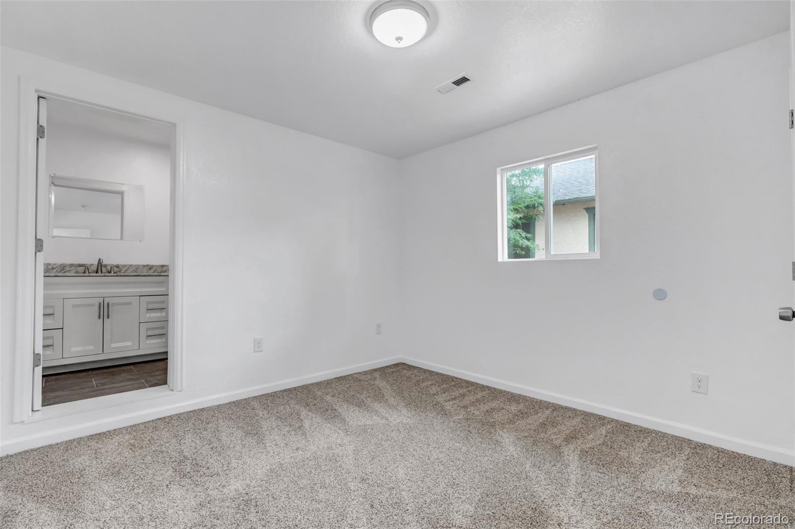 10 South Irving Street Denver, CO 80219 - Photo 22 of 35 an empty room with windows and entrance