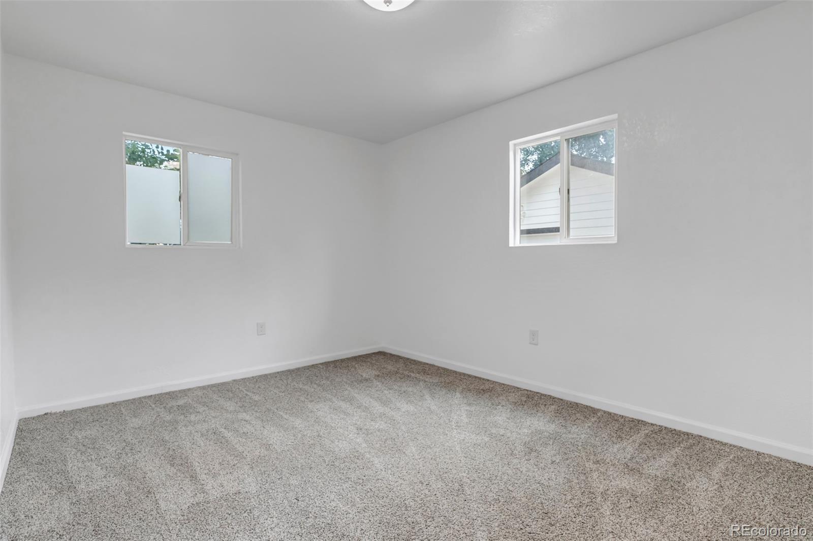 10 South Irving Street Denver, CO 80219 - Photo 26 of 35 an empty room with windows