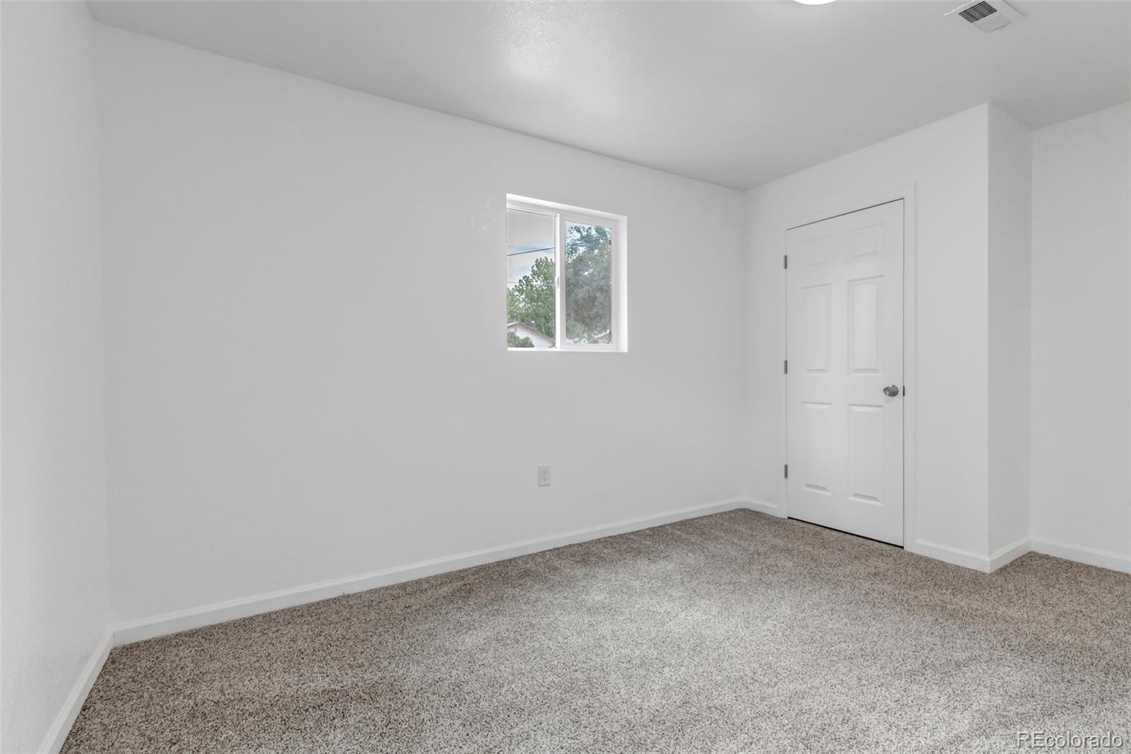 10 South Irving Street Denver, CO 80219 - Photo 27 of 35 an empty room with a window