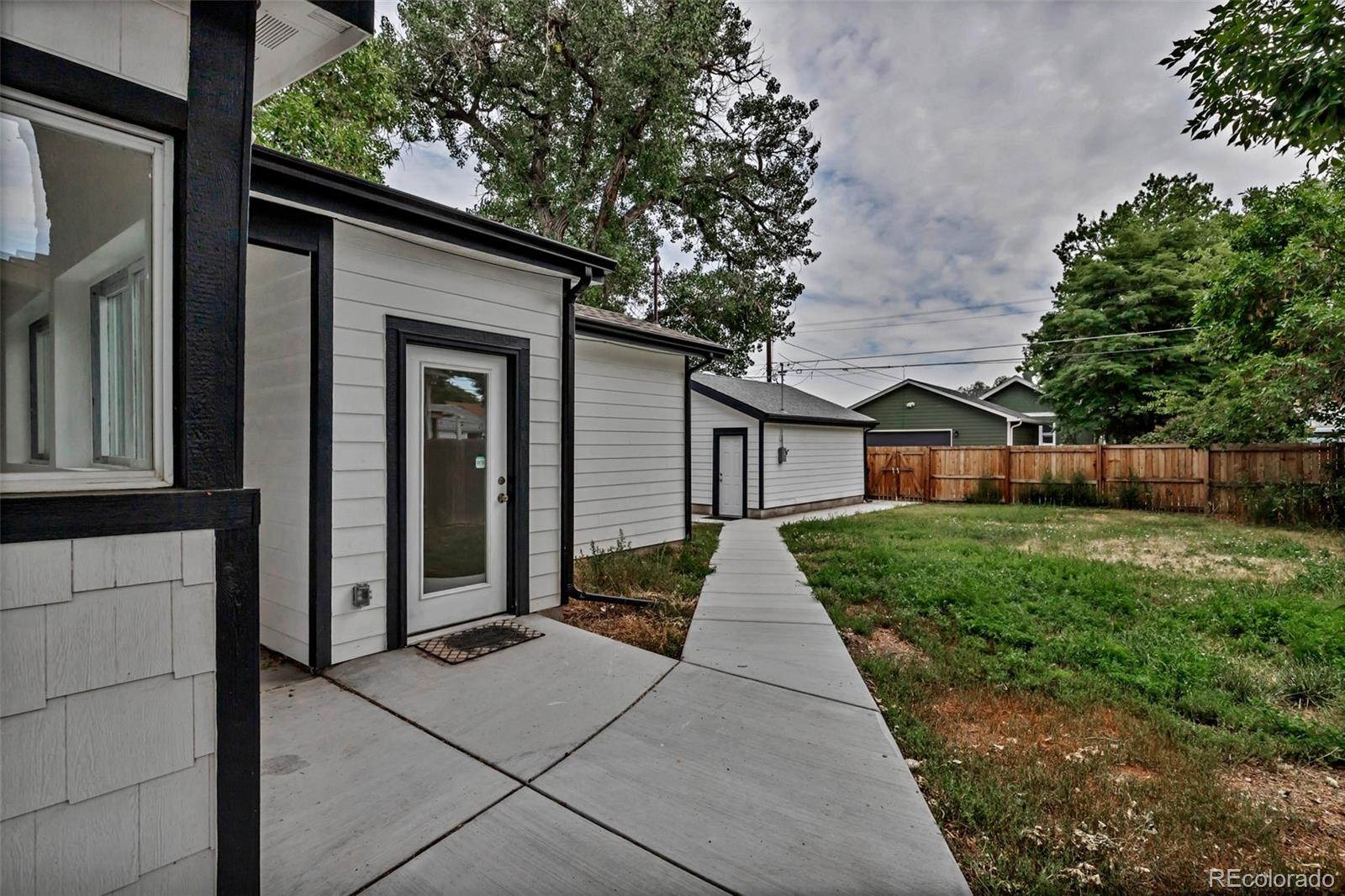 10 South Irving Street Denver, CO 80219 - Photo 33 of 35 a front view of a house with a yard