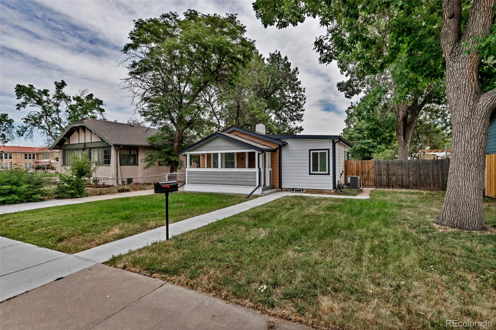 10 South Irving Street Denver, CO 80219 - Photo 5 of 35 a front view of a house with a yard