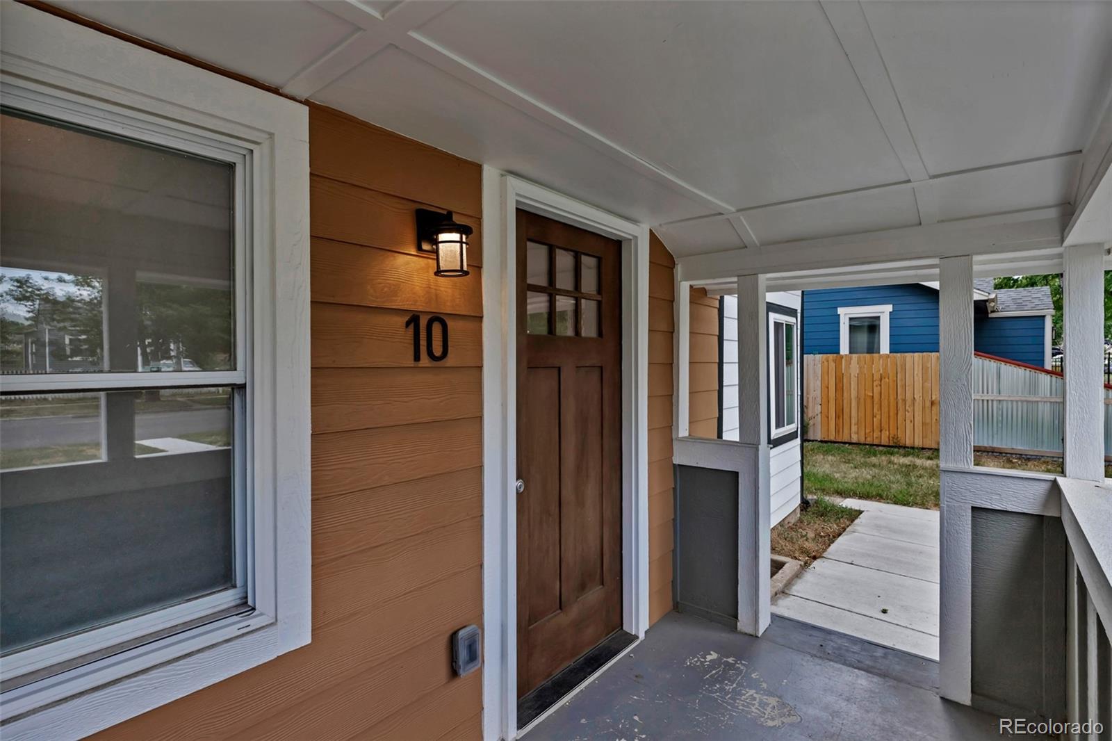 10 South Irving Street Denver, CO 80219 - Photo 7 of 35 a view of porch with a door and balcony