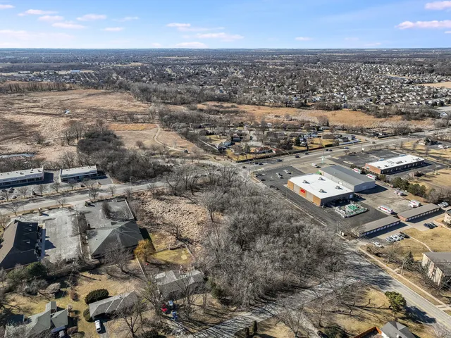 an aerial view of residential building with parking space