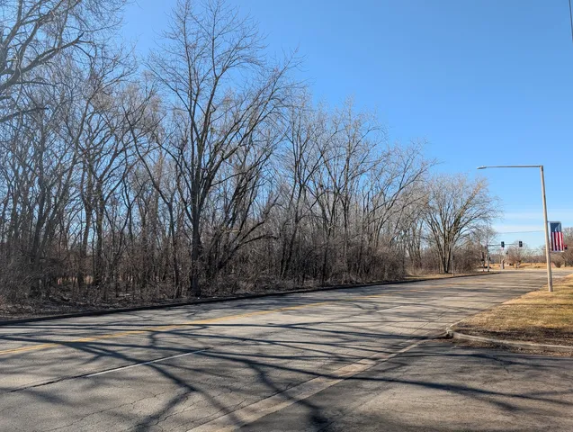 a wooden house with trees in front of it