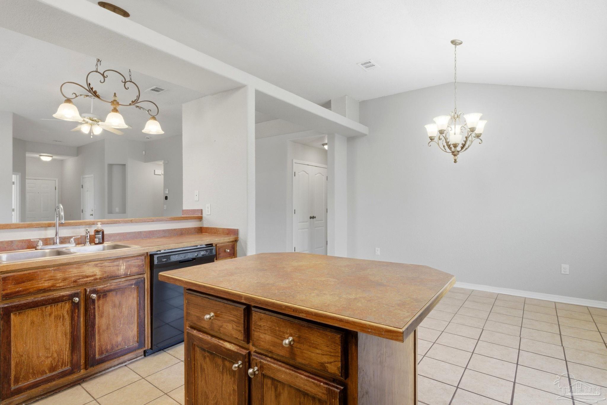 8100 Castle Pointe Way Pensacola, FL 32506 - Photo 20 of 44 a view of a kitchen with a sink and chandelier