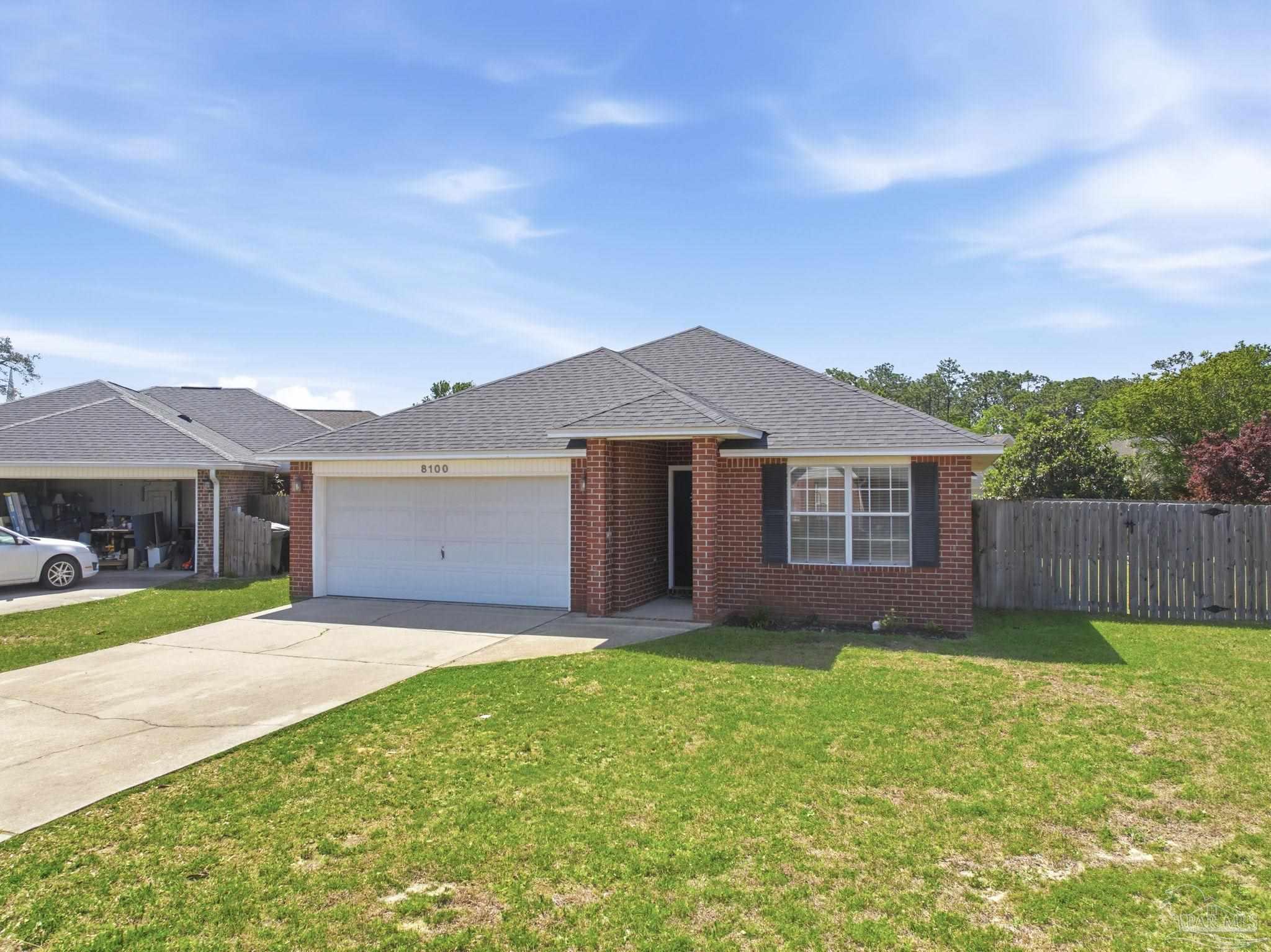 8100 Castle Pointe Way Pensacola, FL 32506 - Photo 2 of 44 a front view of a house with a yard and garage