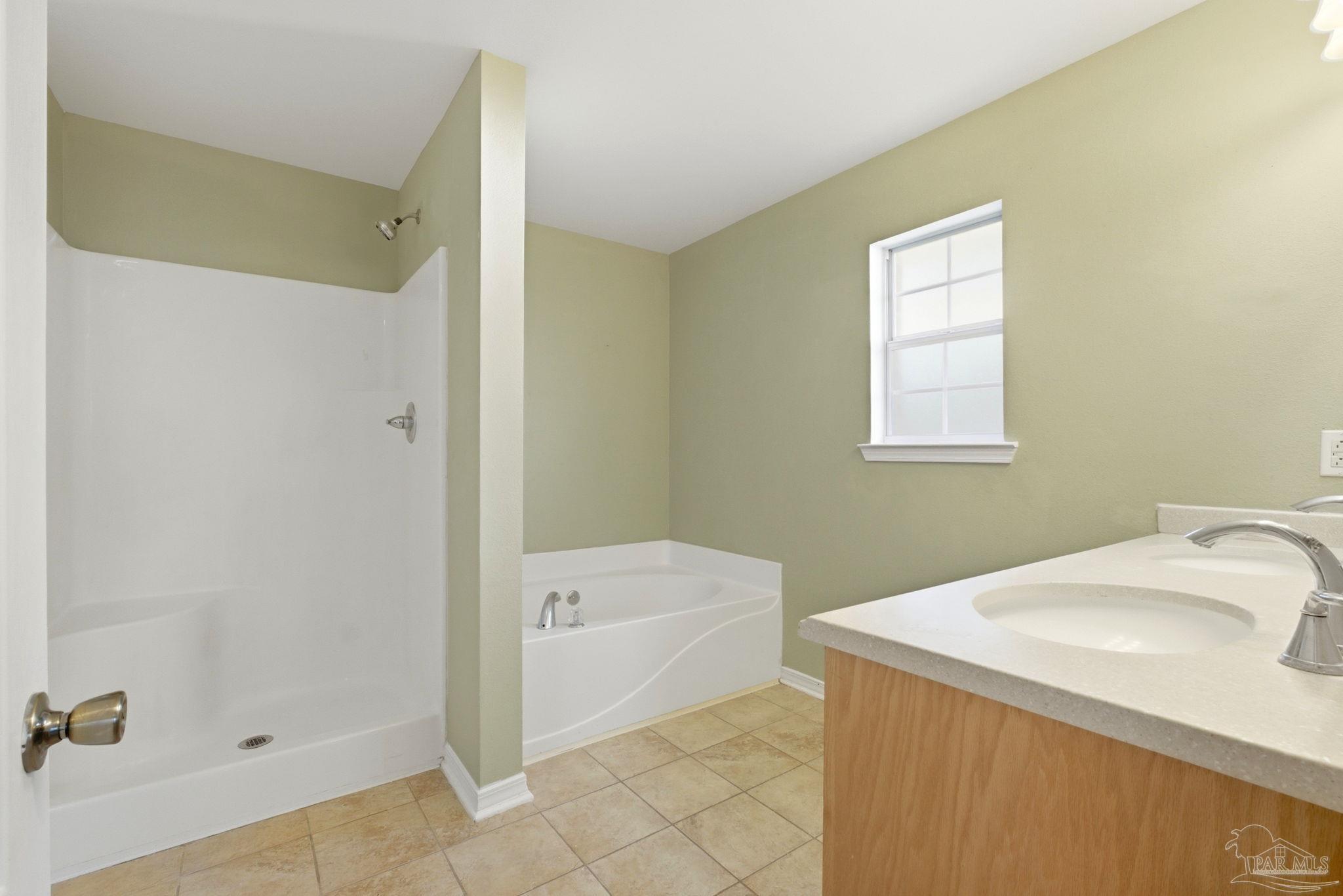 8100 Castle Pointe Way Pensacola, FL 32506 - Photo 25 of 44 a bathroom with a sink a toilet and shower