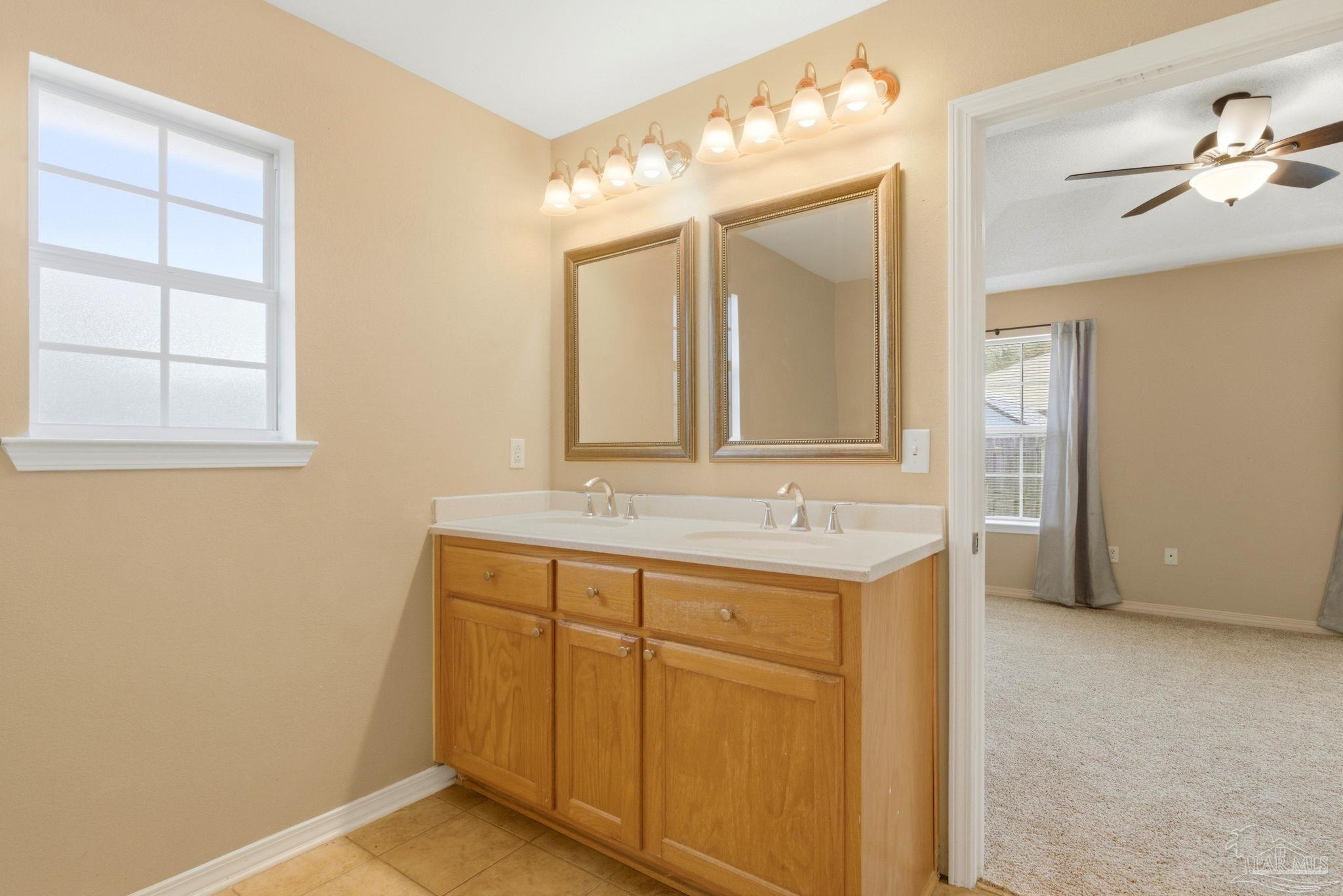 8100 Castle Pointe Way Pensacola, FL 32506 - Photo 29 of 44 a bathroom with a sink and a mirror