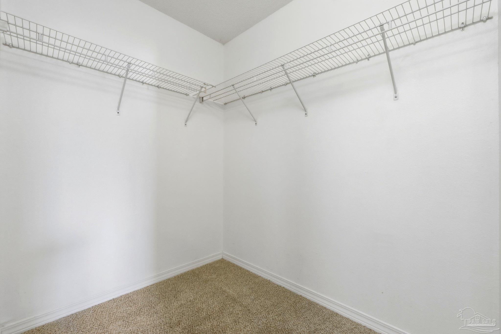 8100 Castle Pointe Way Pensacola, FL 32506 - Photo 32 of 44 a view of a room with racks on the wall