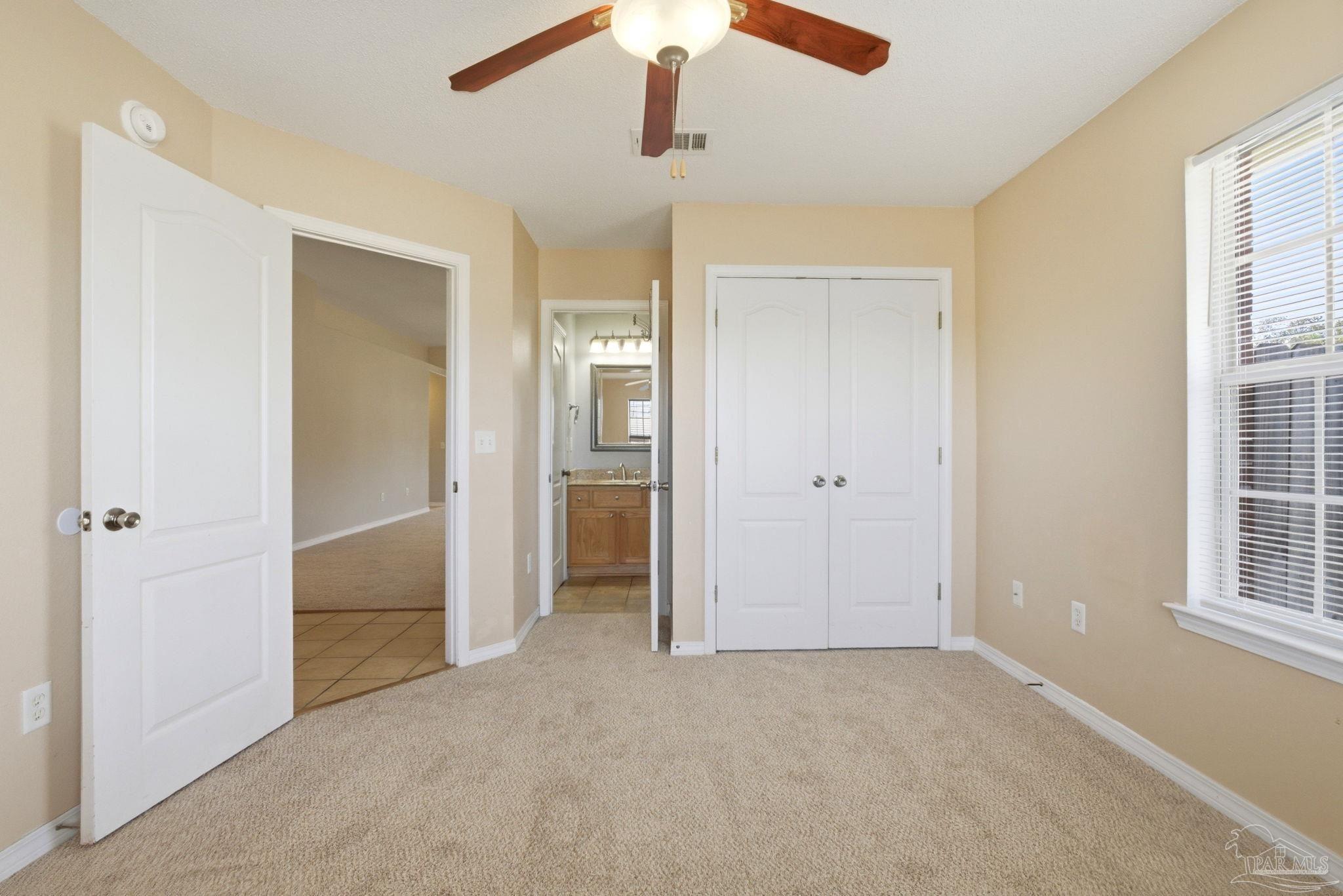 8100 Castle Pointe Way Pensacola, FL 32506 - Photo 34 of 44 an empty room with windows and closet