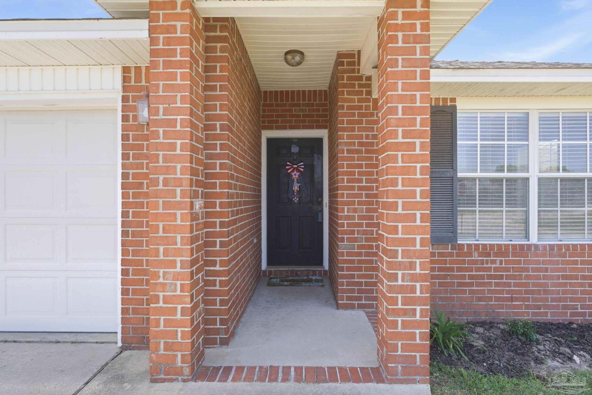 8100 Castle Pointe Way Pensacola, FL 32506 - Photo 4 of 44 a view of front door of house