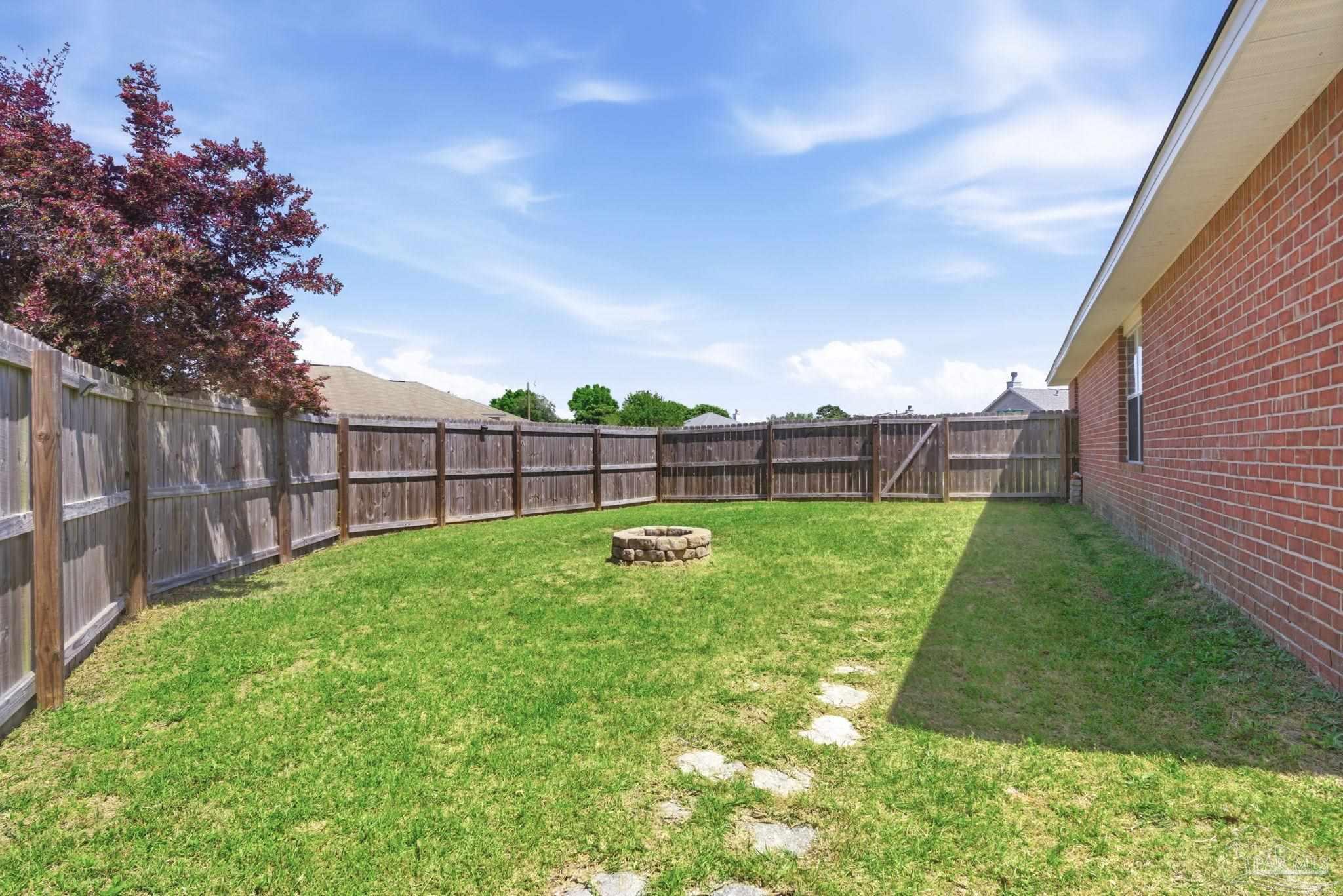 8100 Castle Pointe Way Pensacola, FL 32506 - Photo 42 of 44 a backyard of a house with lots of green space