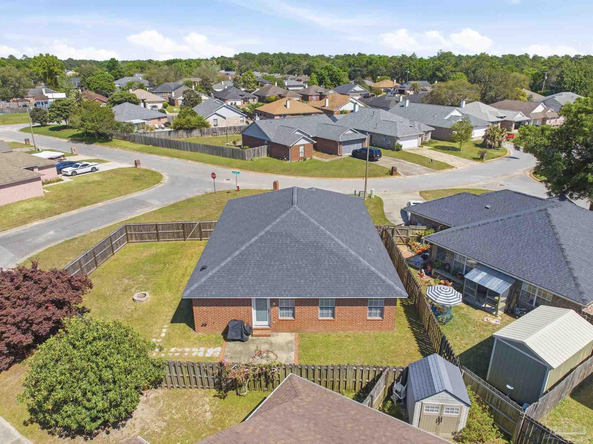 8100 Castle Pointe Way Pensacola, FL 32506 - Photo 43 of 44 an aerial view of residential houses with outdoor space and ocean view