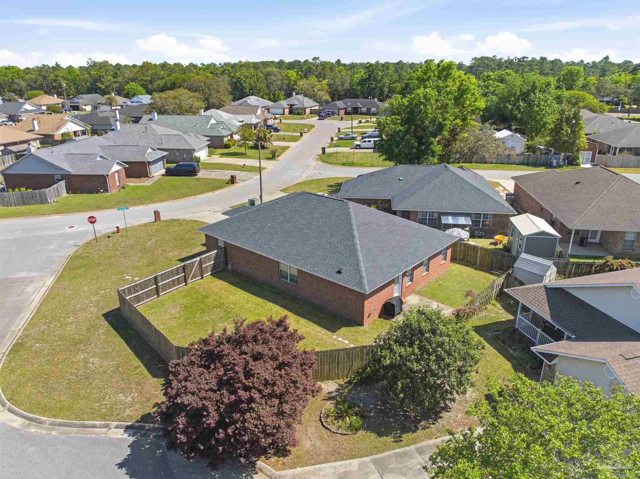 8100 Castle Pointe Way Pensacola, FL 32506 - Photo 44 of 44 an aerial view of residential houses with outdoor space and swimming pool