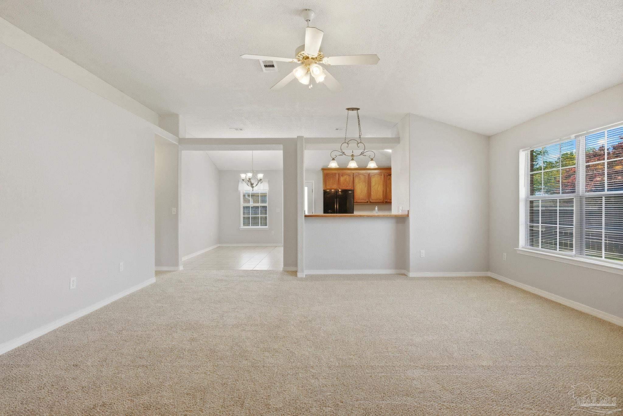 8100 Castle Pointe Way Pensacola, FL 32506 - Photo 6 of 44 an empty room with a empty space and windows