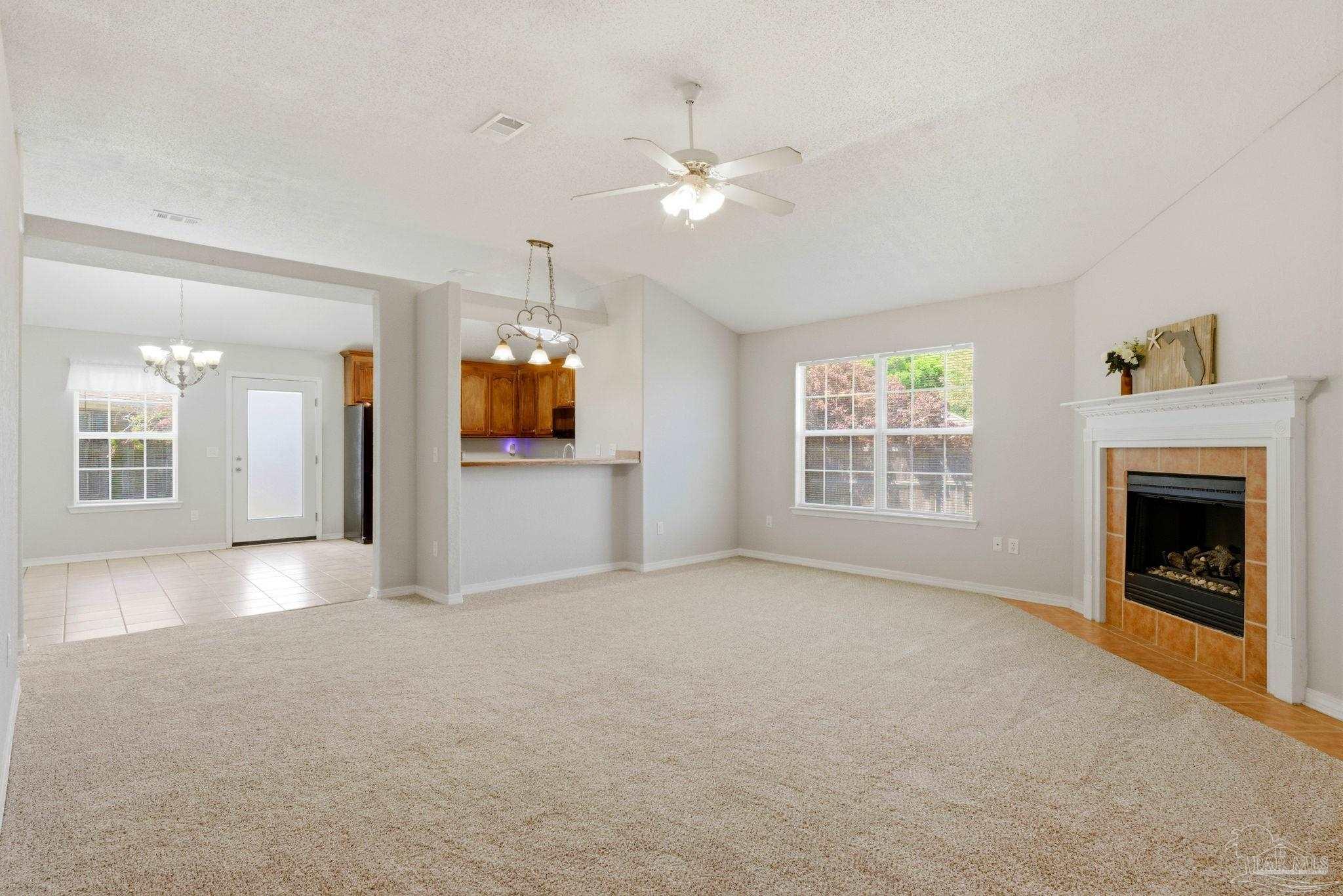 8100 Castle Pointe Way Pensacola, FL 32506 - Photo 7 of 44 a view of a livingroom with a fireplace and window