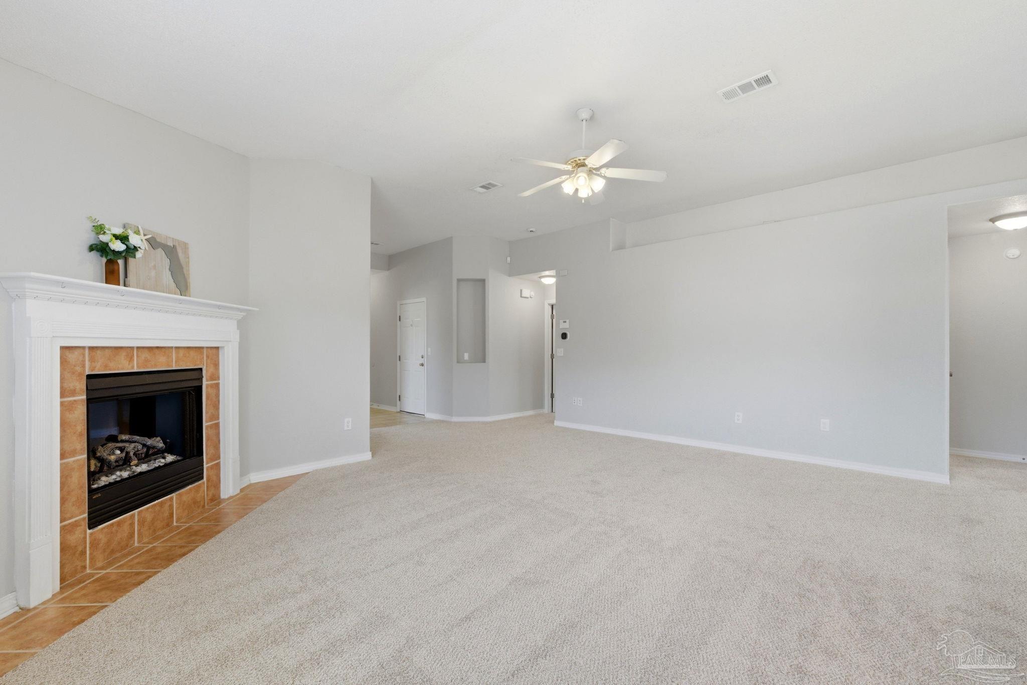 8100 Castle Pointe Way Pensacola, FL 32506 - Photo 9 of 44 a view of an empty room with a fireplace