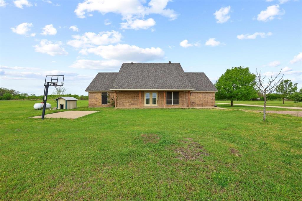 386 Scoggins Road Tioga, TX 76271 - Photo 26 of 30 a aerial view of a house with a yard