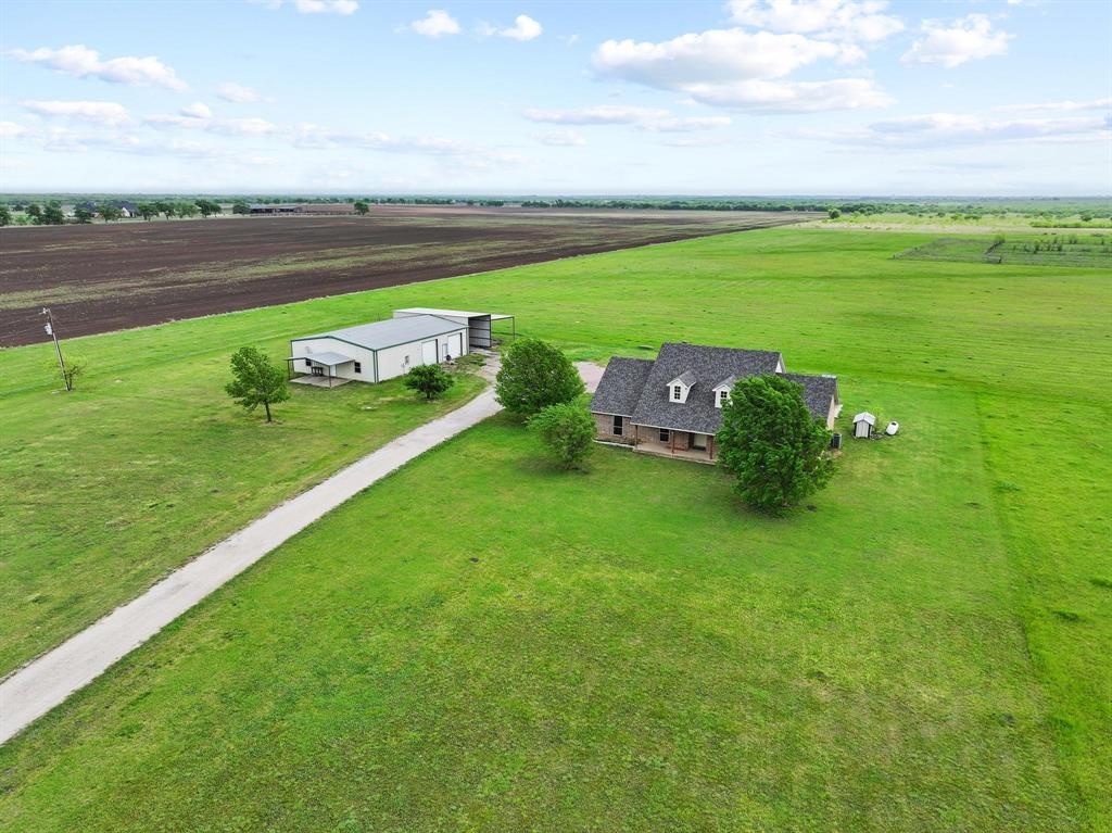 386 Scoggins Road Tioga, TX 76271 - Photo 8 of 30 a view of a golf course with a lake