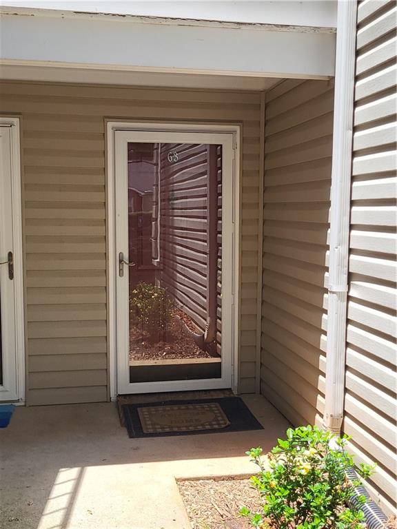 a view of a door and a window