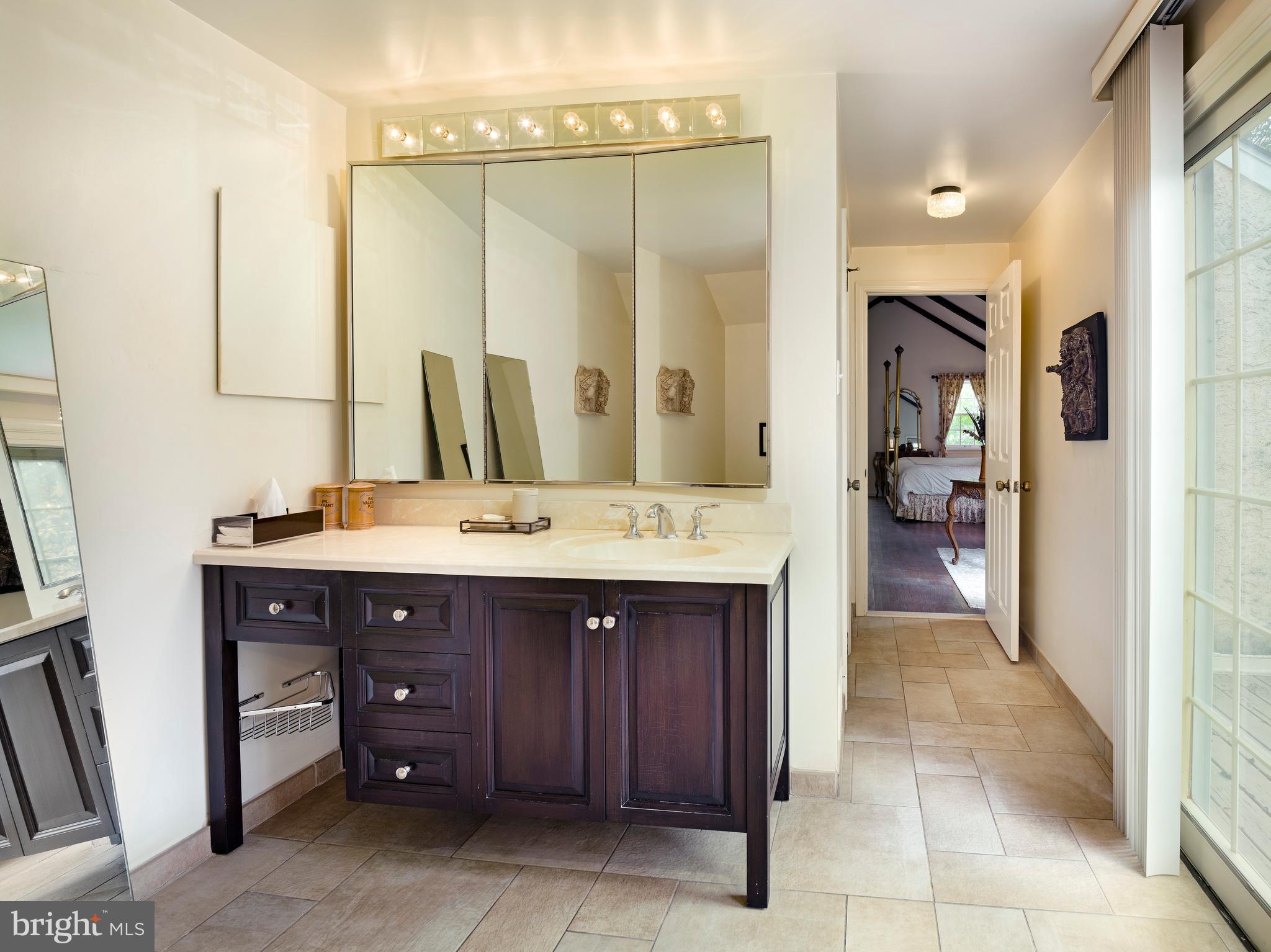 1345 Valley Road Villanova, PA 19085 - Photo 45 of 60 a bathroom with a sink and a mirror