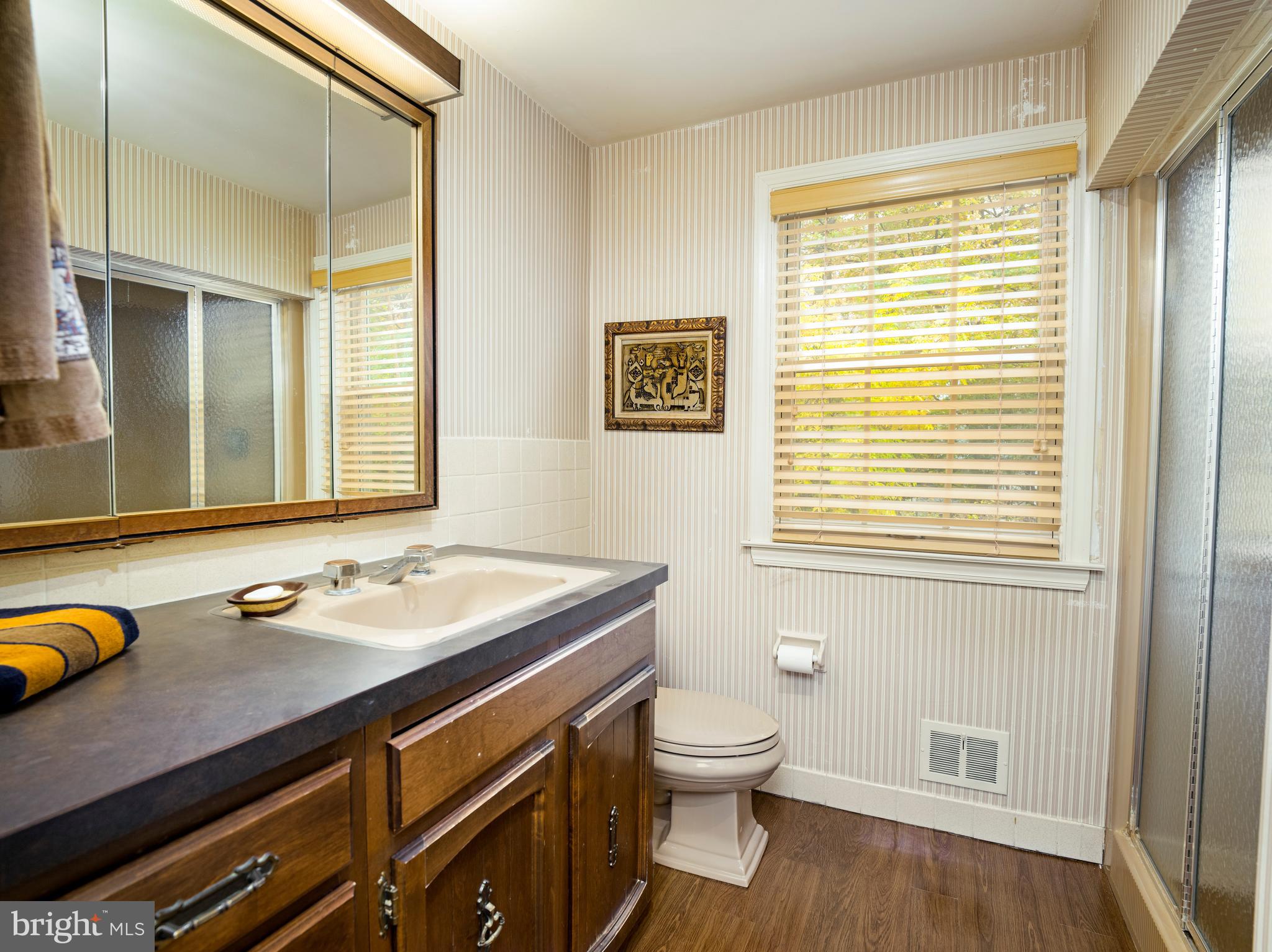 1345 Valley Road Villanova, PA 19085 - Photo 49 of 60 a bathroom with a sink a toilet and a window