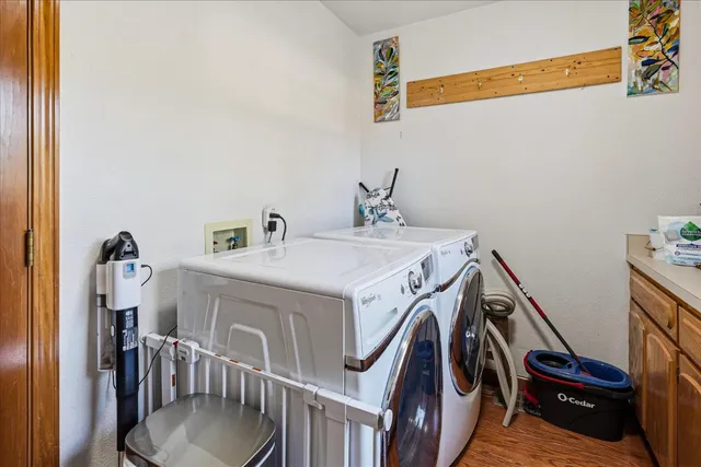 a bedroom with a bed dresser and a walk in closet