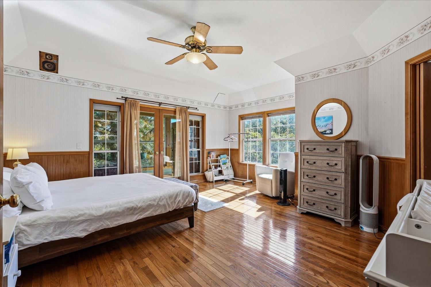 59484 Cascadel Road North Fork, CA 93643 - Photo 39 of 95 a bedroom with a bed a chandelier and a window