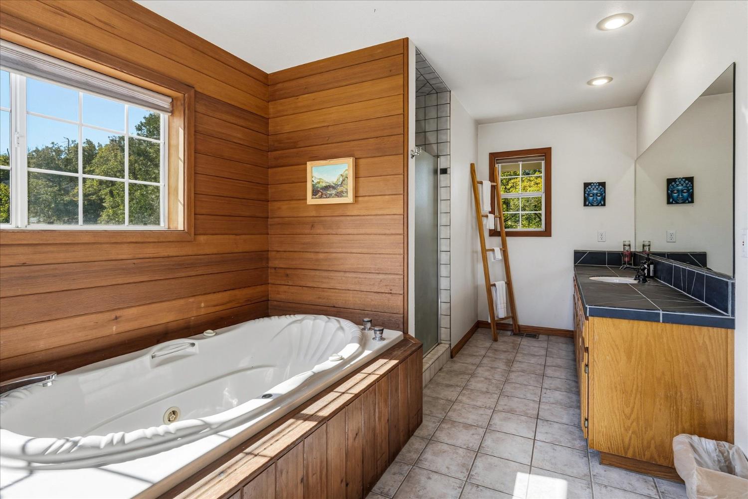 59484 Cascadel Road North Fork, CA 93643 - Photo 42 of 95 a bathroom with a tub a sink and a large window
