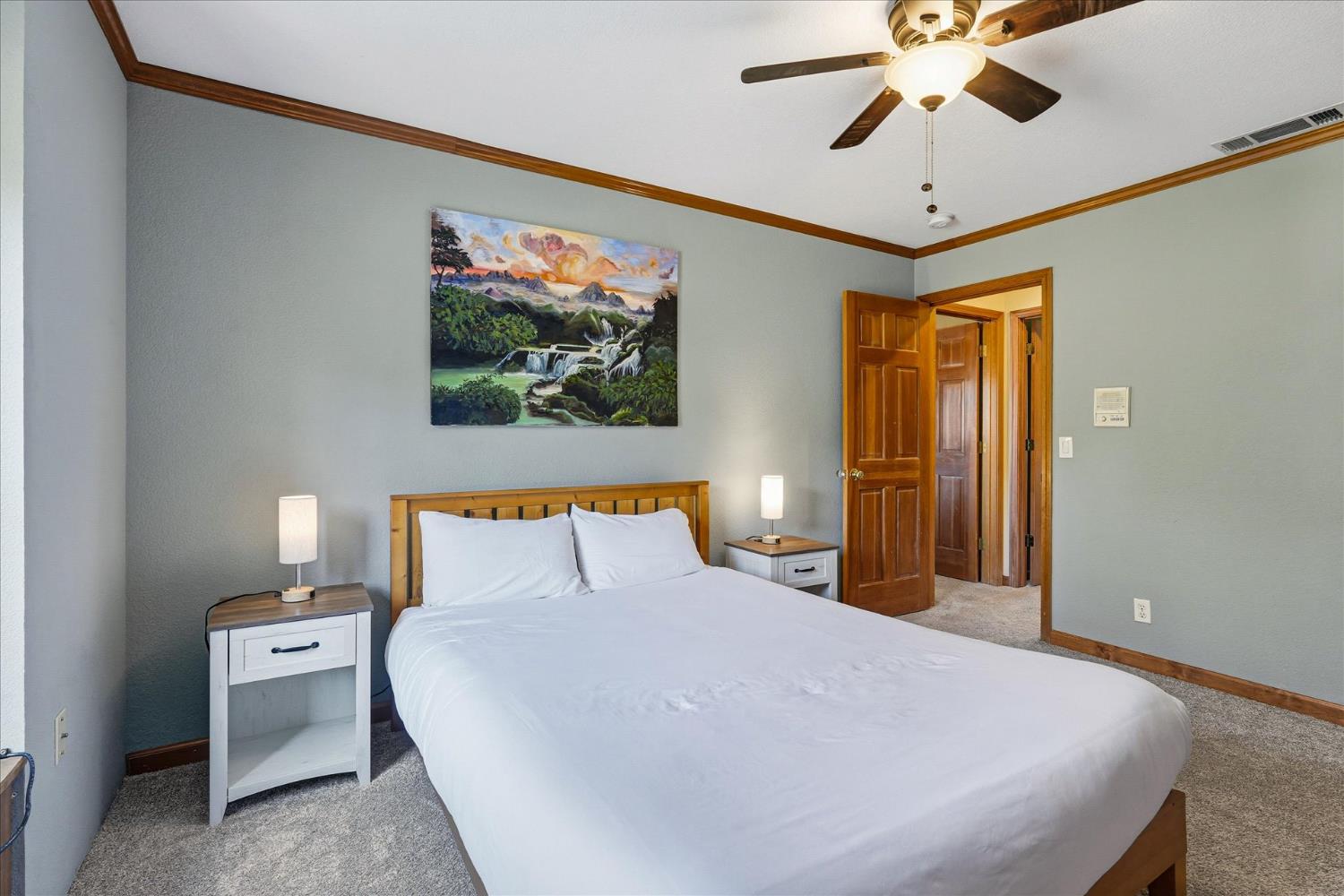 59484 Cascadel Road North Fork, CA 93643 - Photo 52 of 95 a bedroom with a large bed and a chandelier